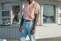 Franklin, wearing powder blue dress pants,50's red and white stripe button up shirt, paired with matching brown leather, blue and white stripe belt.